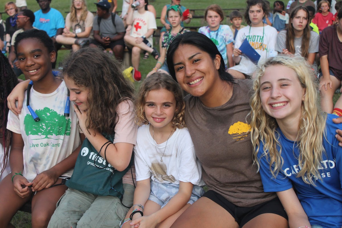 Coach and campers at evening gathering